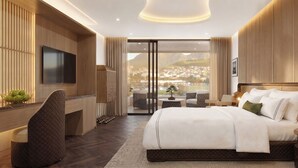 Et moderne hotelværelse med en stor seng, et fjernsyn, et skrivebord og udsigt over bybilledet.