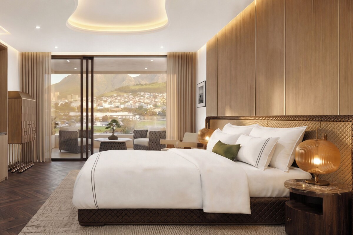 Une chambre d’hôtel moderne, dotée d’un grand lit, d’une télévision, d’un bureau et offrant une vue sur le paysage urbain.