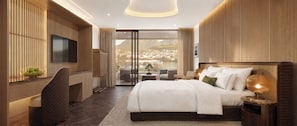 Une chambre d’hôtel moderne, dotée d’un grand lit, d’une télévision, d’un bureau et offrant une vue sur le paysage urbain.