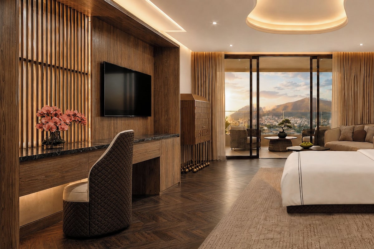 Une chambre d’hôtel moderne équipée d’un grand lit, d’un bureau, d’une chaise et d’un téléviseur.