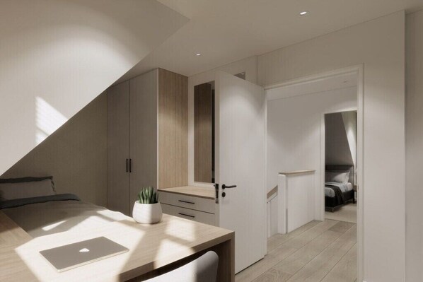 Une chambre à coucher moderne avec un lit, un bureau avec un ordinateur portable et une plante en pot.