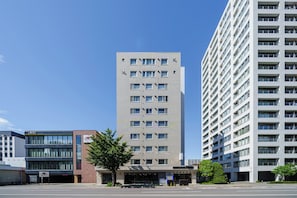 A multi-story building with a modern architectural design, featuring a mix of commercial and residential spaces. - Artside Terrace 1001 (Sapporo)