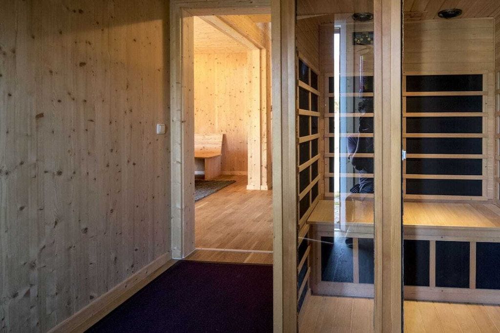 A wooden interior with a visible doorway leading to another room.