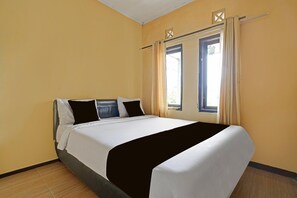 A hotel room with a bed, curtains, and a window. - Luxury Deluxe DBL Retreat W/ Free Wifi and Parking (Surakarta)