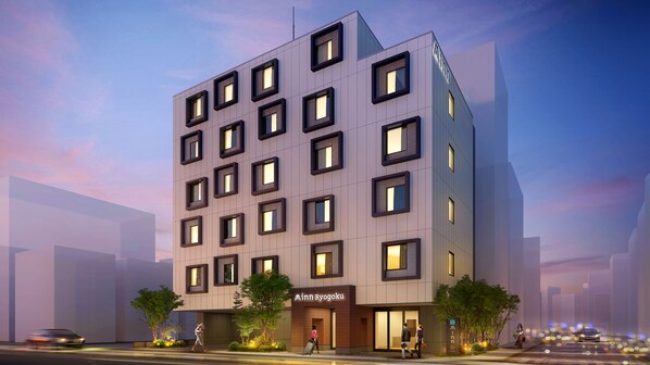 A modern multi-story hotel with a prominent entrance and a visible name sign. - Minn Ryogoku (Sumida)