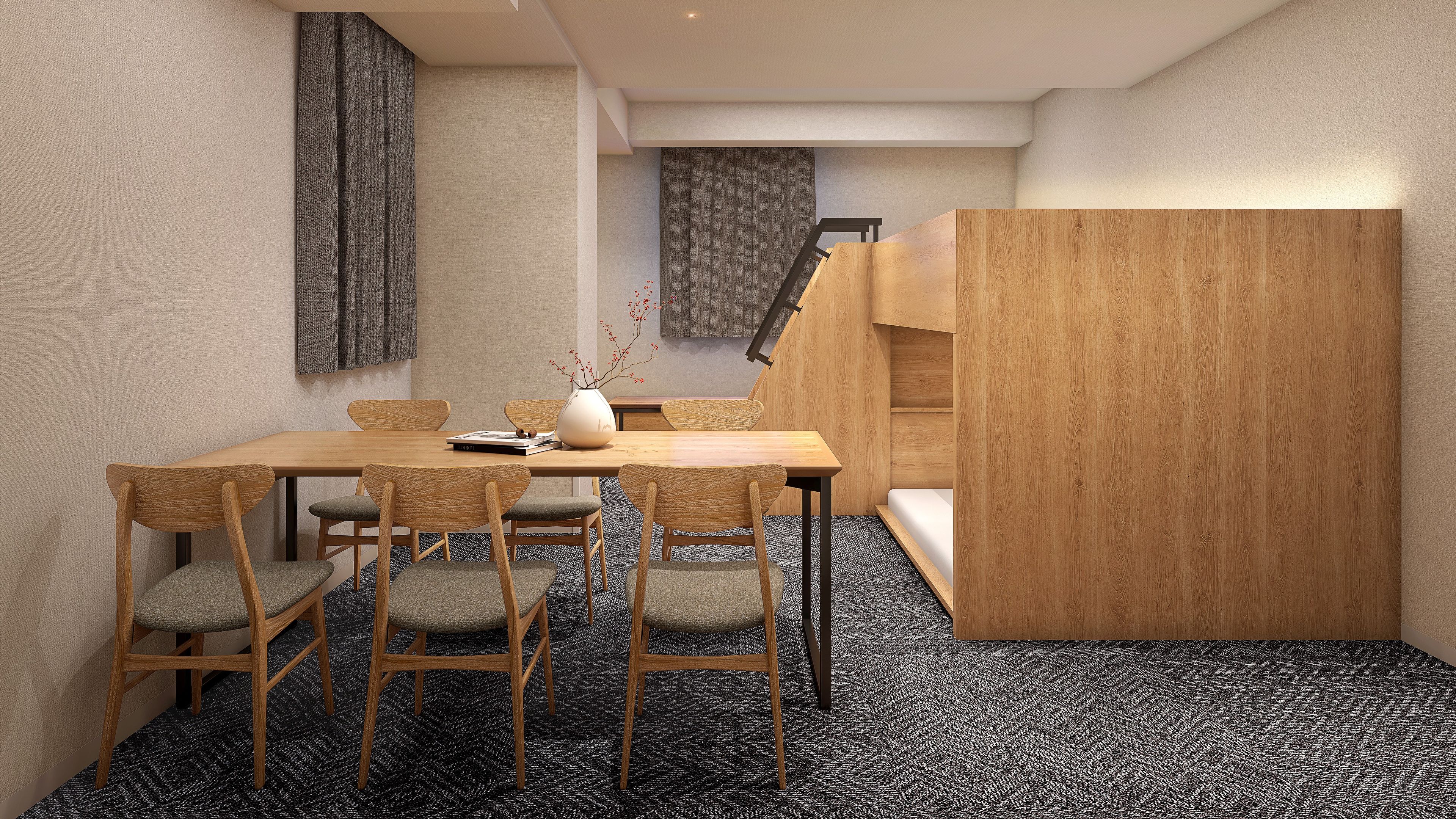 A modern interior with a wooden dining table, four chairs, a vase with branches, and a staircase leading to an upper level.