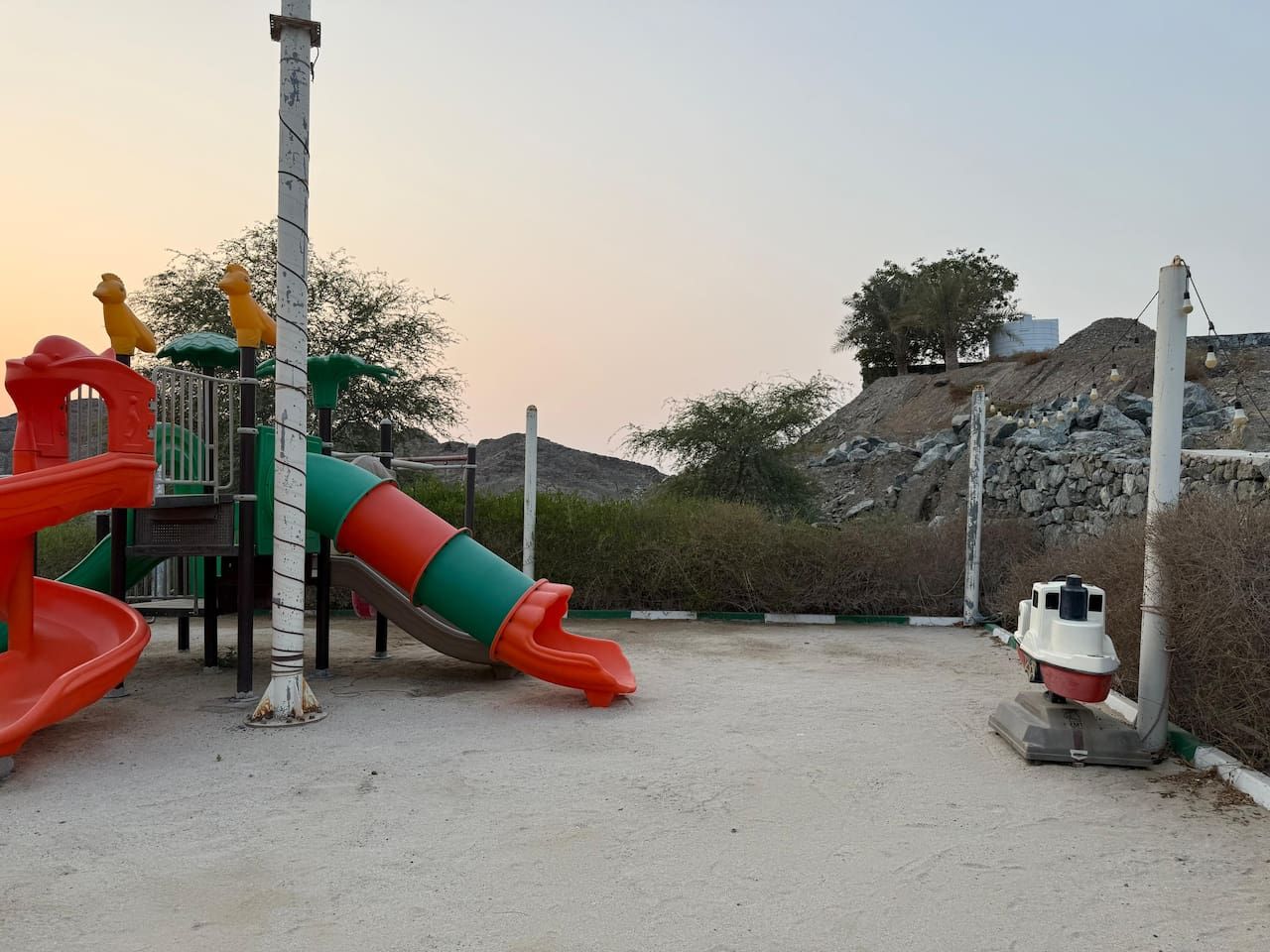 A playground with slides and climbing structures.
