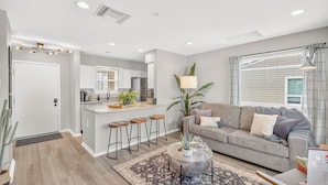 Living area - Riverfront loft just steps from Broadway! Enjoy a king bed, pool, gym, free parking, and modern comforts in this stylish retreat overlooking the Cumberland River. Walk to honky tonks, Nissan Stadium, dining, and live music. (Nashville)
