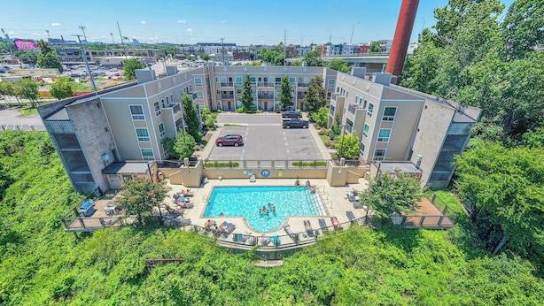 Pool - Riverfront loft just steps from Broadway! Enjoy a king bed, pool, gym, free parking, and modern comforts in this stylish retreat overlooking the Cumberland River. Walk to honky tonks, Nissan Stadium, dining, and live music. (Nashville)