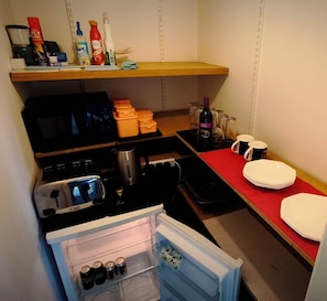 A compact kitchenette with a microwave, toaster, kettle, and a small refrigerator. - Cabin Lodge - Sleeps 4 - Country Views - Parking (Tarporley)