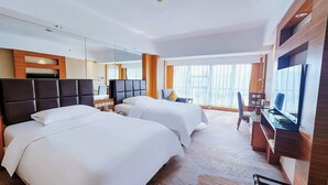 A hotel room with two beds, a desk, a chair, a TV, and a large window. - Empark Grand Hotel Xi'an (Xi'an)