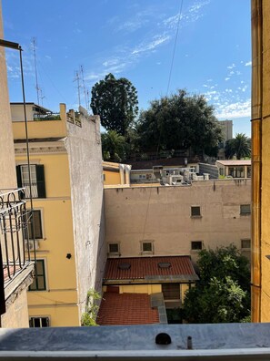 A residential area with multiple buildings, some with visible satellite dishes and antennas. - Luciano Monti Apartment (Roma)