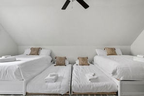 A room with two single beds, white bedding, and a ceiling fan. - The Chantrell Pool Hot Tub Pets (North Charleston)
