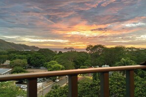 A coastal landscape with a sunset, trees, and a road. - Hermosa del Mar 1-6B | Pools & Gym, Walk to Beach (Playa Hermosa)