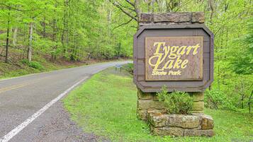 A wooden sign with the text 'Tygart Lake State Park' indicating the location.