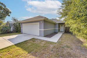 A residential house with a garage, a front door, and a small porch area. - Walk to Parks & Dining! Universal City Home (Universal City)