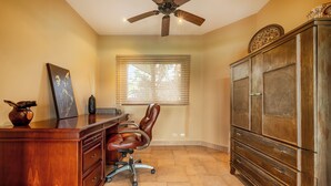 A room with a desk, office chair, and a cabinet. - Near Lake Arenal & Volcano: Duplex Unit w/ Views! (Tronadora)