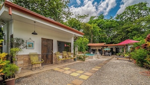A house with a pool, outdoor seating, and a garden. - Poolside Playa Carrillo Hideaway, Walk to Beach (Puerto Carrillo)