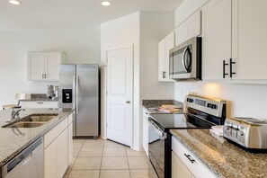 A modern kitchen with stainless steel appliances, a built-in oven, and a microwave. - Yard, Patio & Spacious Interior! Casa Grande Home (Casa Grande)