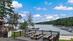 Outdoor dining - Modern 3BR, 2 Bath, Lake House with Firepit, Covered Porch & Year-Round Comfort (Greentown)