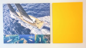 A sailboat with a cabin and deck seating, sailing on the ocean. - Code Zero Apartment by Ca-sa Check (Chioggia)