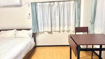 Desk, laptop workspace, blackout curtains, free WiFi