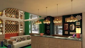 Een moderne woonkamer met een bank, een houten kast en een groen vloerkleed.
