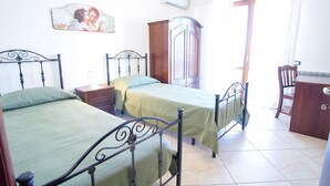A bedroom with two single beds, a wooden wardrobe, a desk, and a chair. - Spacious Sicilian Etna Villa (Trecastagni CT)