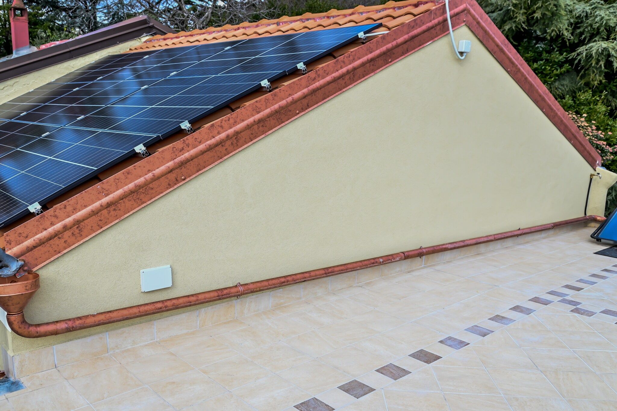 A solar panel installation on a sloped roof.