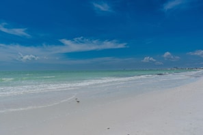 A beach with clear skies and calm waters. - Salty Seahorse (Fort Myers Beach)