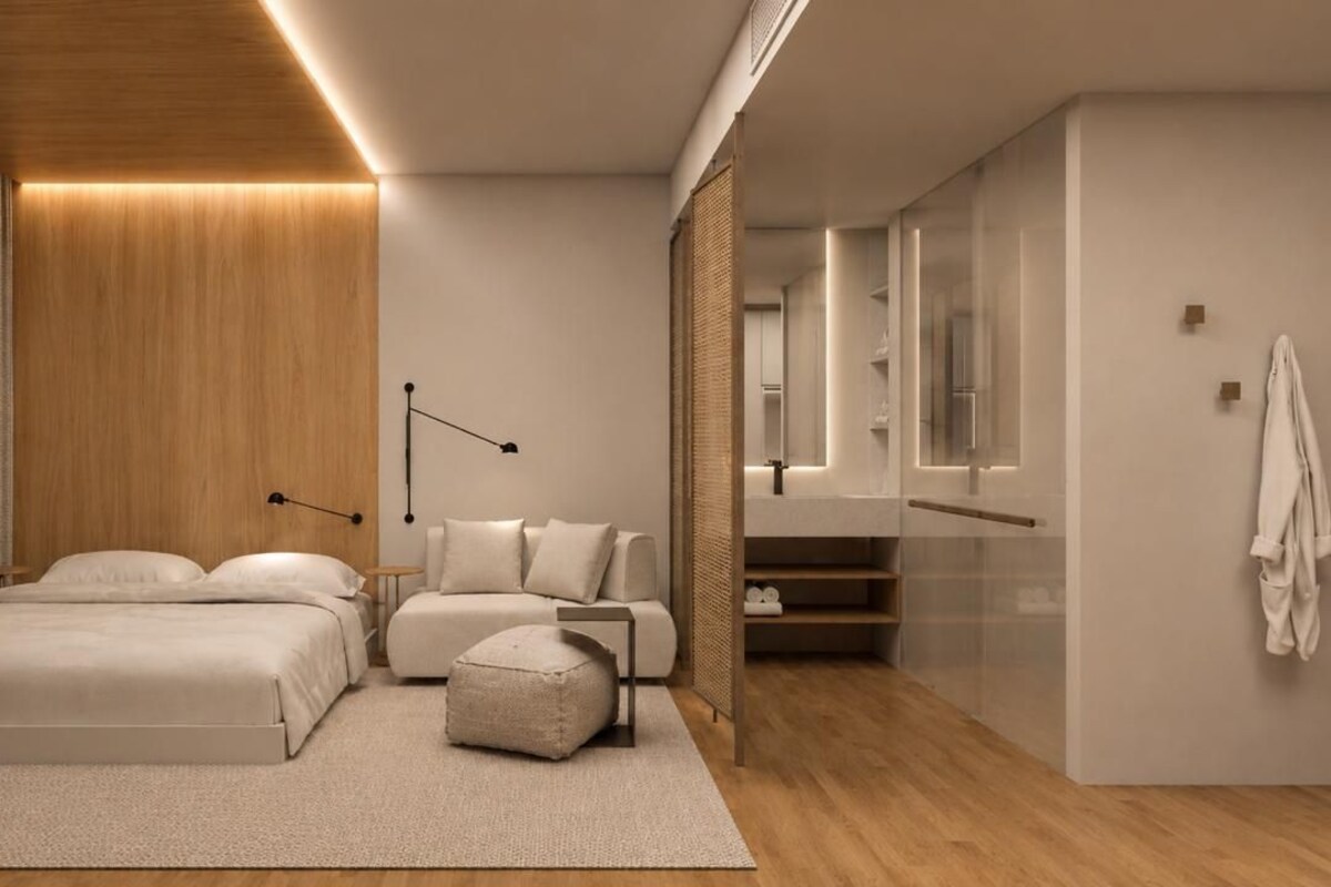 Un dormitorio moderno con cama, mesita de noche, lámpara y armario.