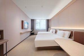 A hotel room with two beds, a desk, a chair, and a window with curtains. - G Jinhua Hotel Apartments - Shanghai (Shanghai)