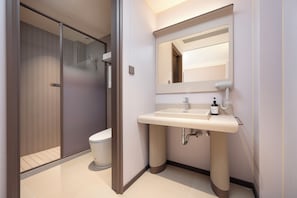 A modern bathroom with a toilet, sink, and shower. - G Jinhua Hotel Apartments - Shanghai (Shanghai)