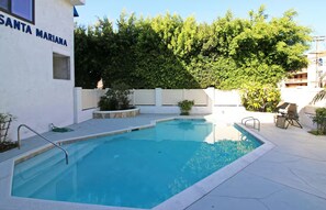 A swimming pool with a white wall and a sign reading 'SANTA MARINA'. - Bay View Condo Near SeaWorld, San Diego (San Diego)