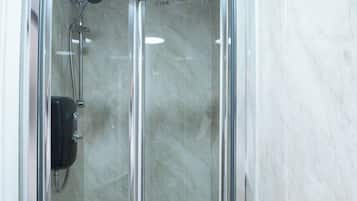Shower, towels, toilet paper