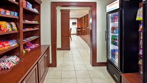 A hotel lobby with a snack bar, a refrigerator stocked with beverages, and a seating area with chairs and a table. - Accessible Suite w/ Kitchen | Free Breakfast! (Elkhart)