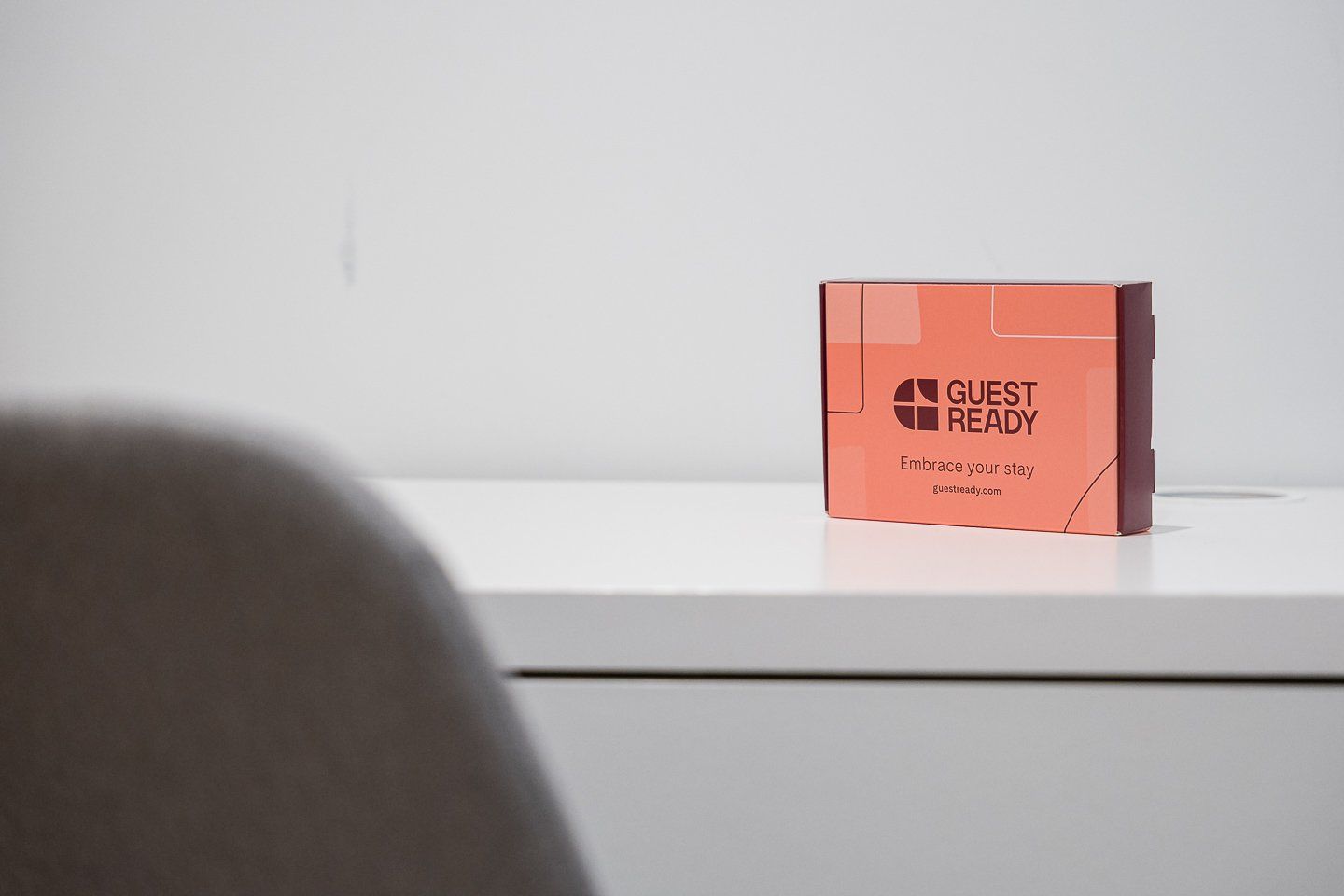 A box labeled 'GUEST READY' with the text 'Embrace your stay' and a website address 'guestready.com'.