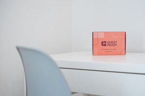 A white table with a pink box labeled 'GUEST READY' on it. - GuestReady - PoetikBlue - Room 5 (Porto)
