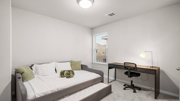 A bedroom with a bed, a desk, and a chair. - Comfort Meets Space - Feel Right at Home (Cypress)