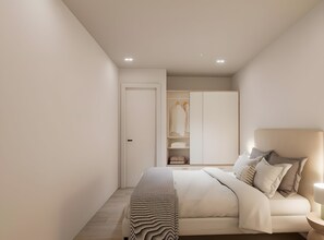 A modern bedroom with a bed, bedside table, and a wardrobe. - Apartment 'Piso Martita' with Wi-Fi (Cedeira)