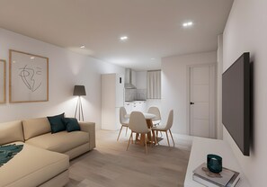 A modern living room with a sofa, a dining area with chairs, a kitchen in the background, and a flat-screen TV mounted on the wall. - Apartment 'Piso Martita' with Wi-Fi (Cedeira)