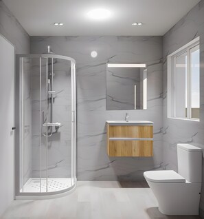 Un baño moderno con ducha envuelta en cristal, tocador de madera y váter blanco.