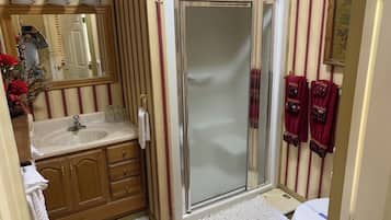 Shower, hair dryer, towels, soap