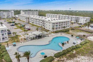 A hotel with multiple buildings, a central swimming pool, and a parking area. - Gulf Shores Plantation 4506- Top Floor Gulf View (Gulf Shores)