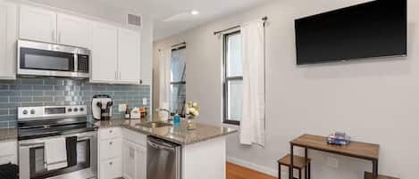 Coffee/tea maker, fridge, microwave, oven