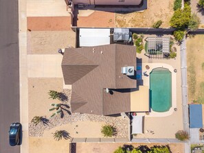 A residential property with a swimming pool, a covered patio, and a garage. - New Listing - Dog-Friendly Pool Home in Peoria 15 mins from State Farm Stadium! (Peoria)