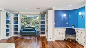 A room with a bed, a desk, and shelving units. - The Reset Estate by Avantstay Book for ACL Sleeps 22 Pool + Hot Tub + Sauna Casita 2 Acres (Austin)