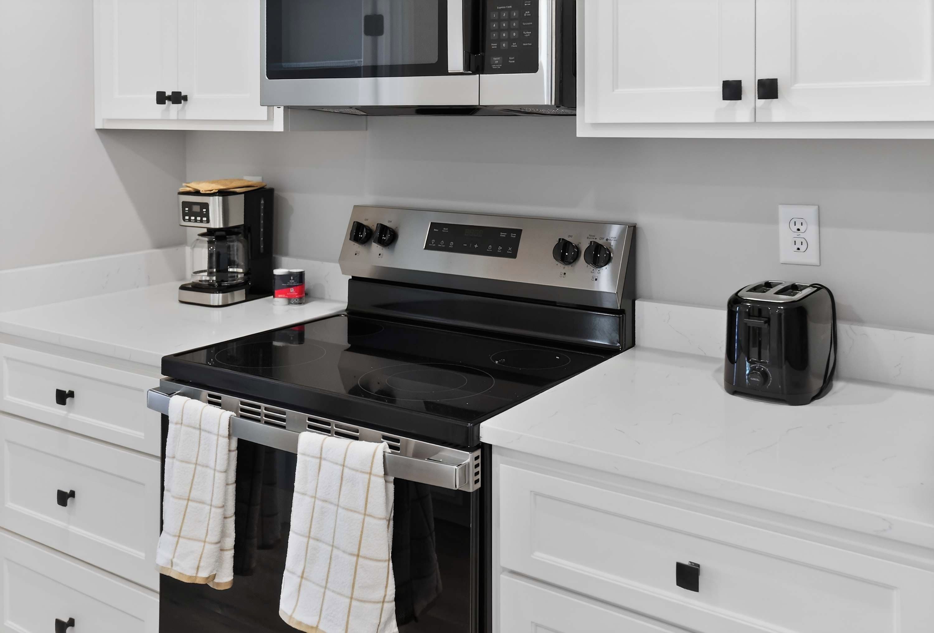 Coffee/tea maker, fridge, microwave, oven