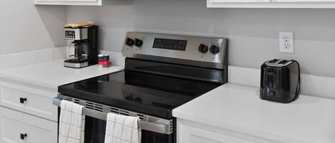 Coffee/tea maker, fridge, microwave, oven