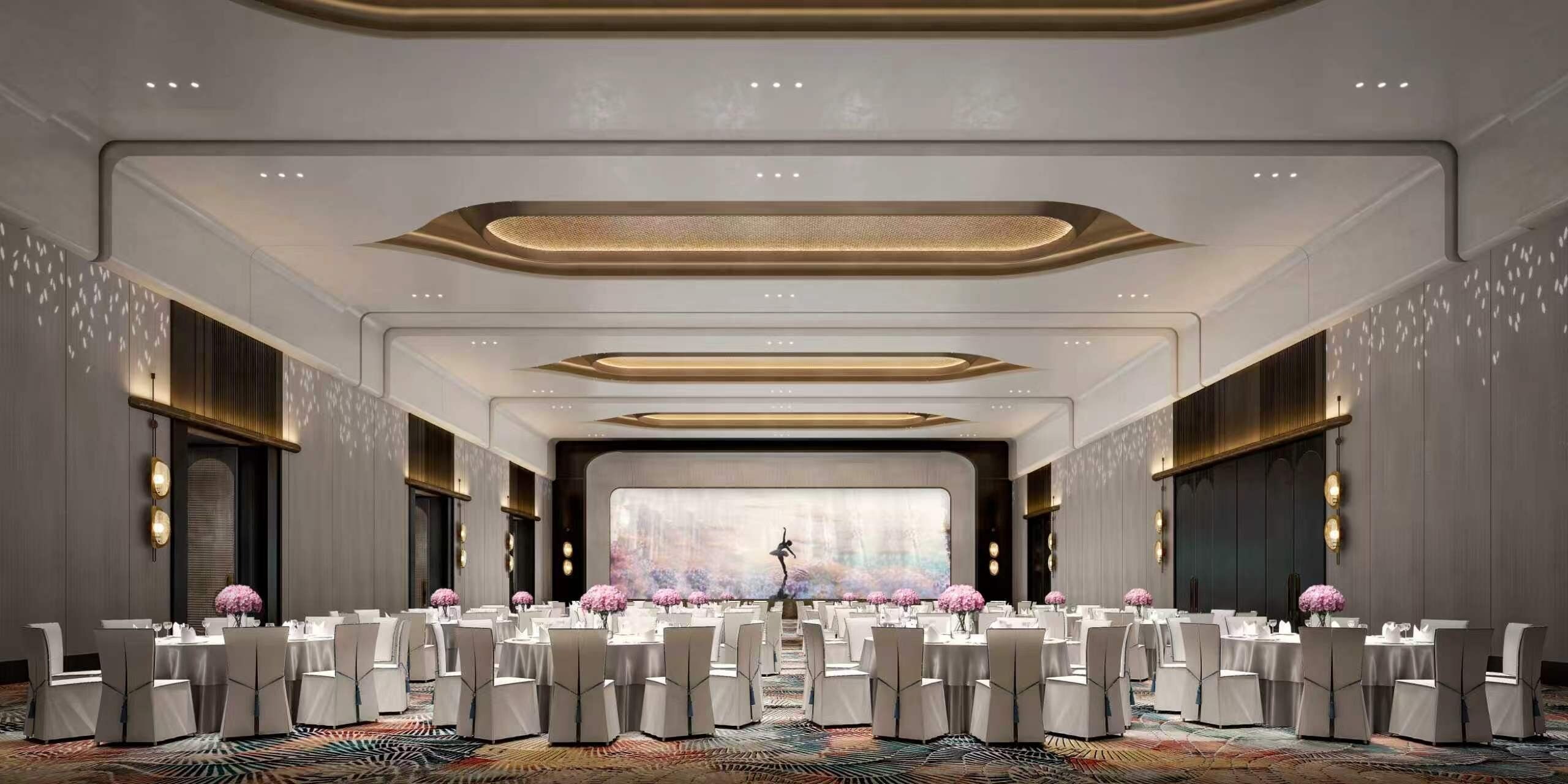 A spacious conference room with multiple tables and chairs, a large screen at the front, and a patterned carpet.
